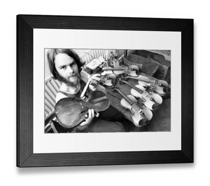 Framed Print : Tarquin Bolton at the Sunderland Violin Hospital in July 1980 set up to repair damaged