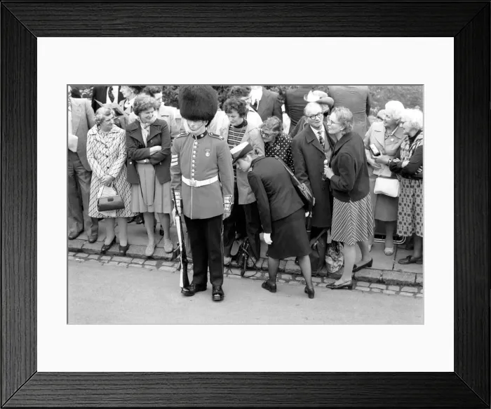 Framed Print : Armed soldier of the Coldstream guards on duty as the crowd watches behind during