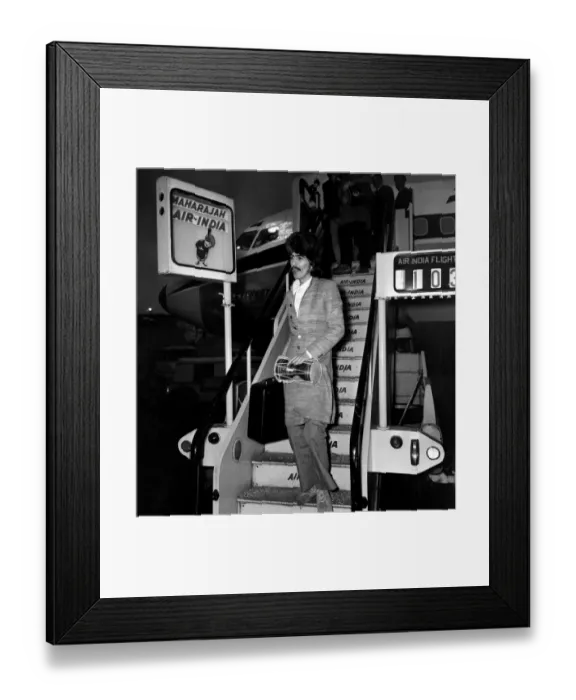 Framed Print : George Harrison of the Beatles at Heathrow airport where he arrived from India where he