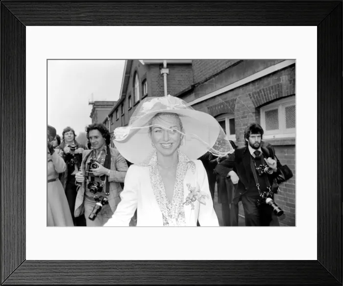 Framed Print : Woman wearing a large hatduring the second day of races at Ascot today