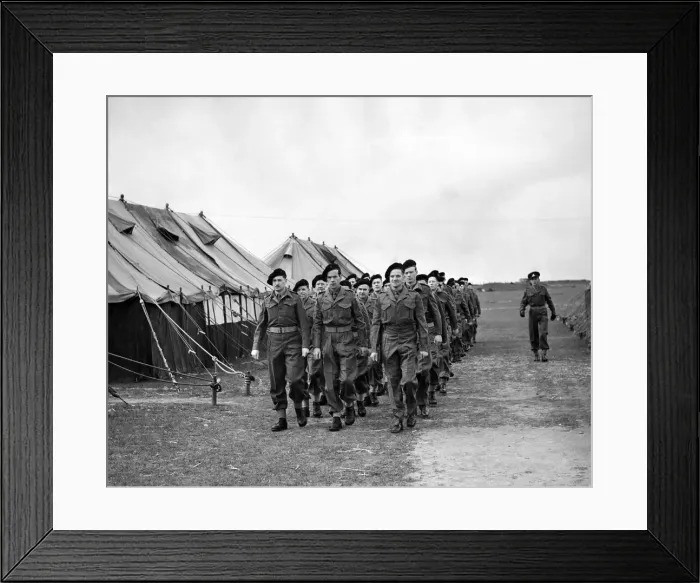 Framed Print : Back in uniform, and back in line. A squad of newly uniformed Z men march past a line of Framed Print : Back in uniform, and back in line. A squad of newly uniformed Z men march past a line of