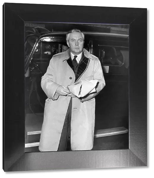 Labour Party MP Harold Wilson at the Royal Free Hospital wearing a Gannex coat