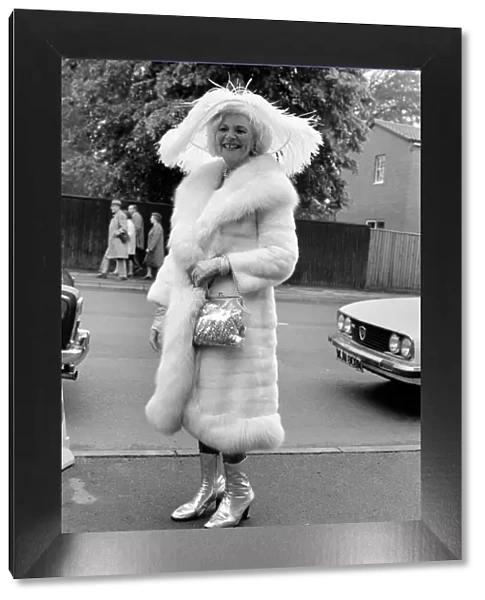 Mrs. Gertrude Shilling wearing a Ostrich feather hat with white Mink and Fox fur coat