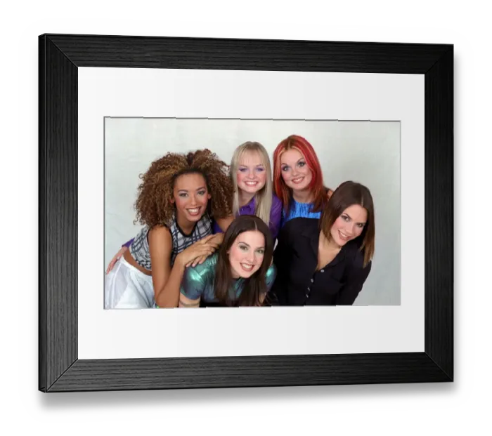 Framed Print : British all girl pop group The Spice Girls pose for a group photograph in the Daily