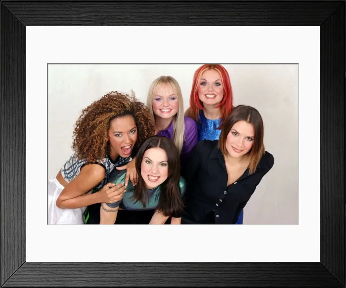 Framed Print : British all girl pop group The Spice Girls pose for a group photograph in the Daily