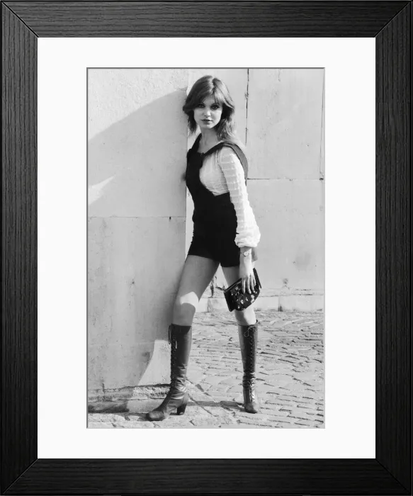 Framed Print : Model and horror film actress Madeline Smith poses wearing hot pants suit with knee high Framed Print : Model and horror film actress Madeline Smith poses wearing hot pants suit with knee high