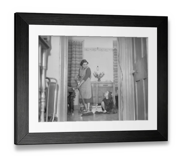 Framed Print : Stay at home mother Mrs Mary Mackenzie seen here bing helped in her household chores by Framed Print : Stay at home mother Mrs Mary Mackenzie seen here bing helped in her household chores by