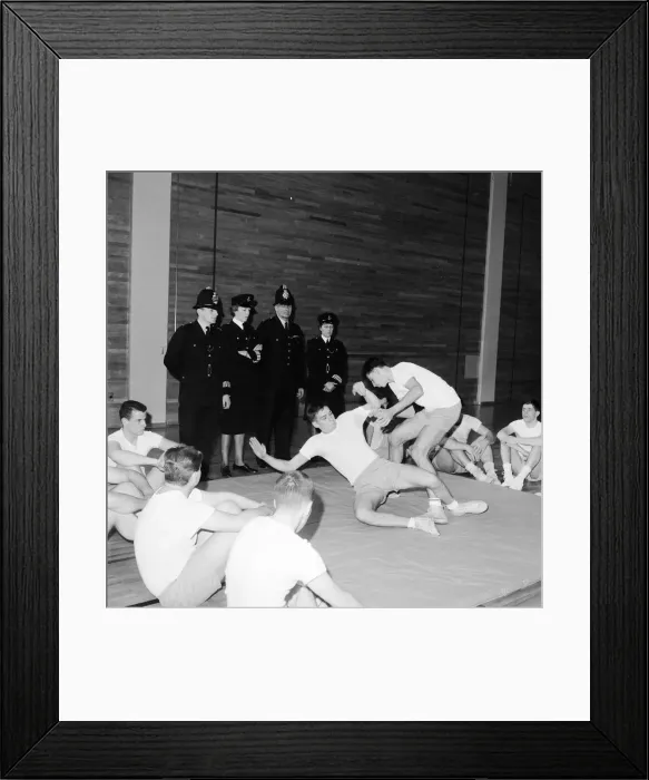 Framed Print : English police officers watch & take part in a hand to hand fighting training session Framed Print : English police officers watch & take part in a hand to hand fighting training session