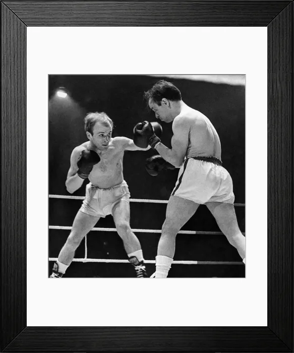 Framed Print : British flyweight boxer John McCluskey in action against Manolin Alvarez during their Framed Print : British flyweight boxer John McCluskey in action against Manolin Alvarez during their