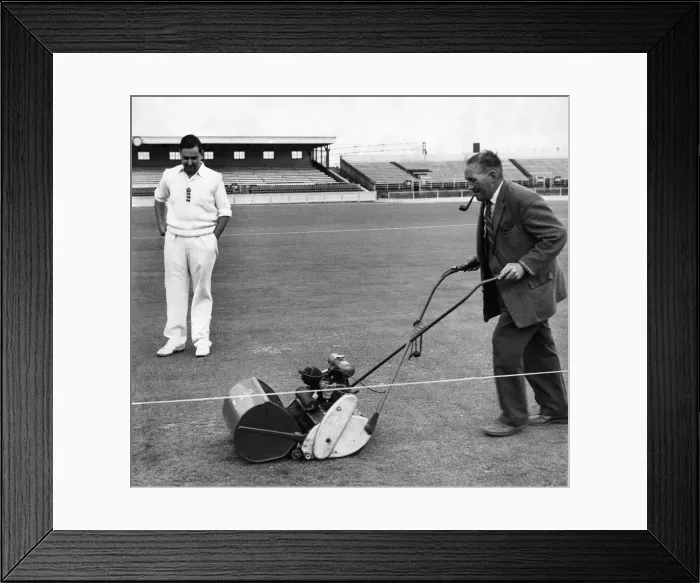 Framed Print : England batsman Colin Cowdrey watches groundsman Bert Flack add the finishing touches to