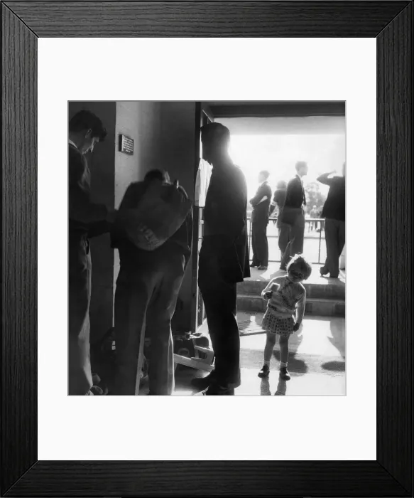 Framed Print : Scene at the mens dressing rooms when athletes dressed have a chat at the entrance