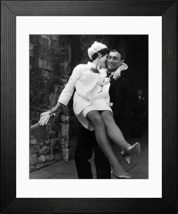 Framed Print : Bride carried by the groom out of the church after their wedding Framed Print : Bride carried by the groom out of the church after their wedding