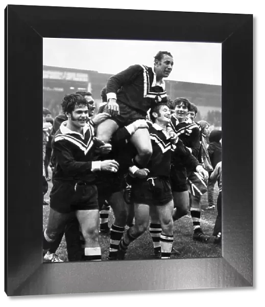 New Zealand players carry off their captain Roy Christian after beating Great Britain in