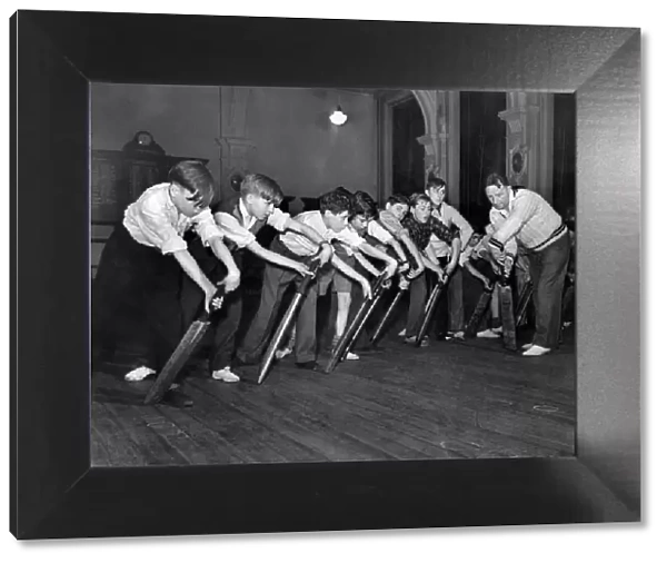 Cricket Coaching. Boys follow Mr. Moseleys example in this forward shot