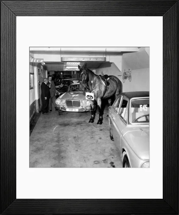 Framed Print : A man who is still selling cars to the public, but has changed his mode of transport