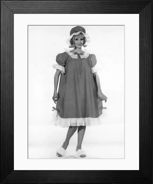 Framed Print : Model Margaret London wearing a long baggy style night dress with frilly trims Framed Print : Model Margaret London wearing a long baggy style night dress with frilly trims