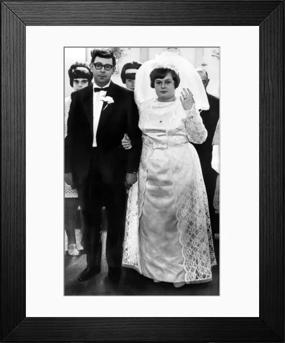 Framed Print : Then: Nervous expressions as the couple pose for the wedding-day picture that Margaret Framed Print : Then: Nervous expressions as the couple pose for the wedding-day picture that Margaret
