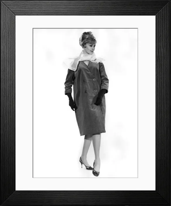 Framed Print : Model Jo Waring wearing a three quarter length buttoned coat with full length gloves Framed Print : Model Jo Waring wearing a three quarter length buttoned coat with full length gloves
