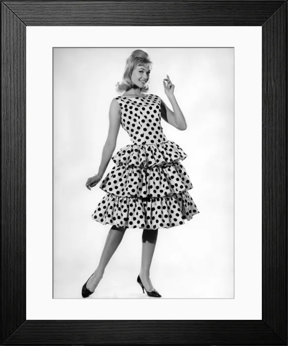 Framed Print : Model Jo Waring wearing a polka dot patterned dress with frills Framed Print : Model Jo Waring wearing a polka dot patterned dress with frills