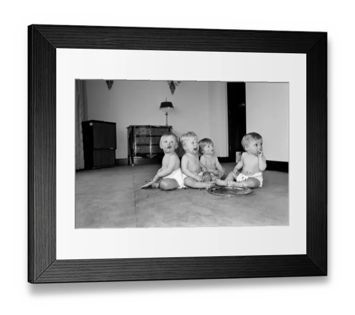 Framed Print : A group of young babies seen here getting into a mess with a chocolate cake at a babies