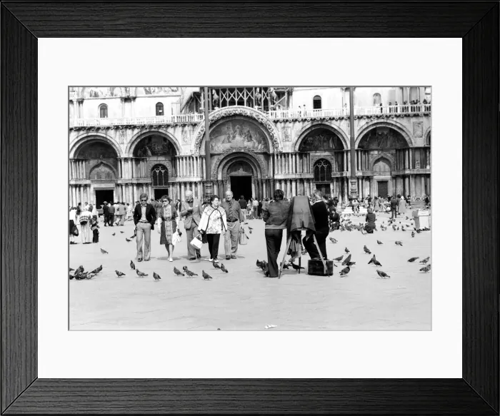 Framed Print : General scenes in Venice. Tourist walk past a photographer using a old style glass plate Framed Print : General scenes in Venice. Tourist walk past a photographer using a old style glass plate