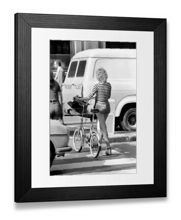 Framed Print : Model with a bicycle in Kings Road Chelsea, London. April 1975 75-2156-009