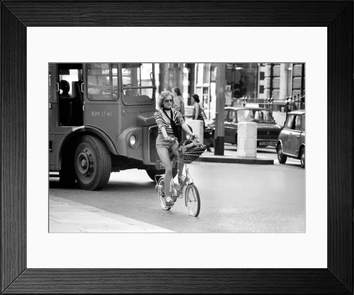 Framed Print : Model riding a bicycle in Kings Road Chelsea, London. April 1975 75-2156-009 Framed Print : Model riding a bicycle in Kings Road Chelsea, London. April 1975 75-2156-009