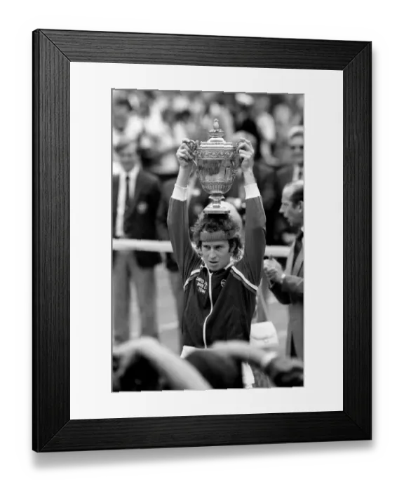 Framed Print : Wimbledon Tennis: Mens Finals 1981: John McEnroe shows of the golden trophy to
