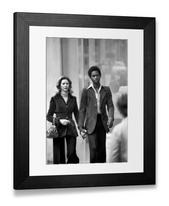 Framed Print : Man and woman walking through the streets of Paris, France Framed Print : Man and woman walking through the streets of Paris, France