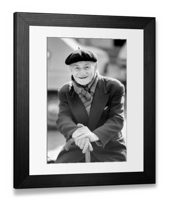 Framed Print : An old man of Paris wearing beret, scarf and coat on a coald day in France April