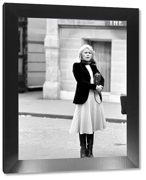 Woman walking through the streets of Paris, France. April 1975 75-2099-011