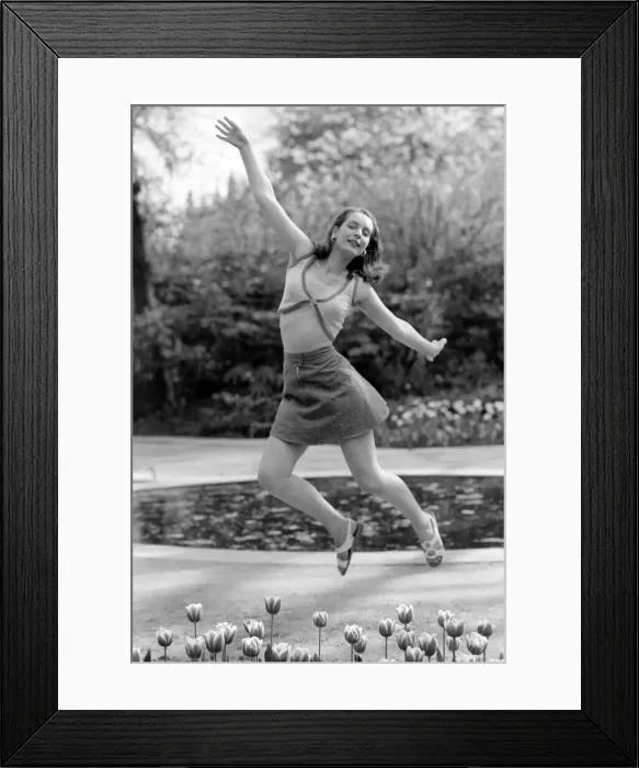 Framed Print : 21 years old Marie France dancing amongst the tulips in her local park
