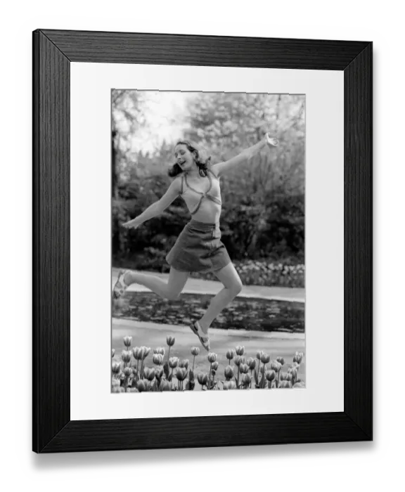Framed Print : 21 years old Marie France dancing amongst the tulips in her local park