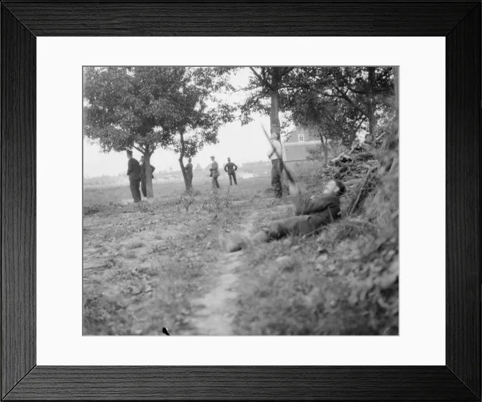 Framed Print : A more exciting sport than grouse shooting. A Belgian soldier trying to bring down a
