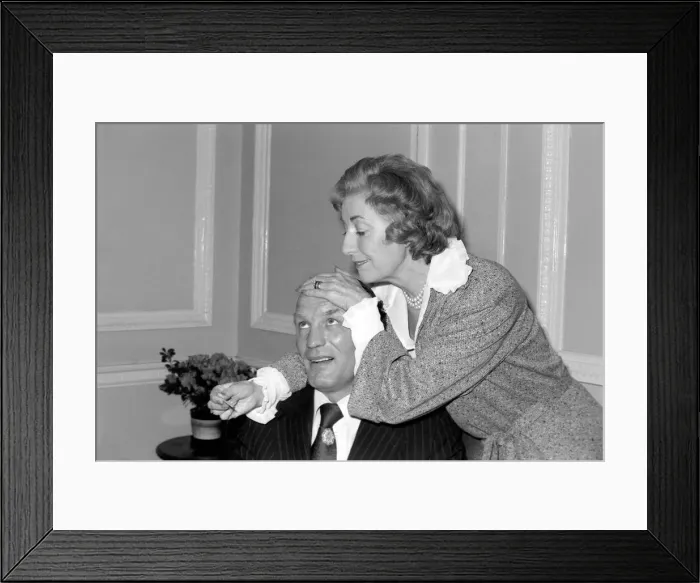 Framed Print : Dame Vera takes the temperature of her patient Henry Cooper. January 1976 76-00059-002 Framed Print : Dame Vera takes the temperature of her patient Henry Cooper. January 1976 76-00059-002