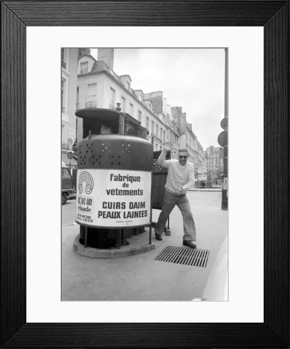 Framed Print : A man waves as he walks out of a public convenience in Paris Framed Print : A man waves as he walks out of a public convenience in Paris
