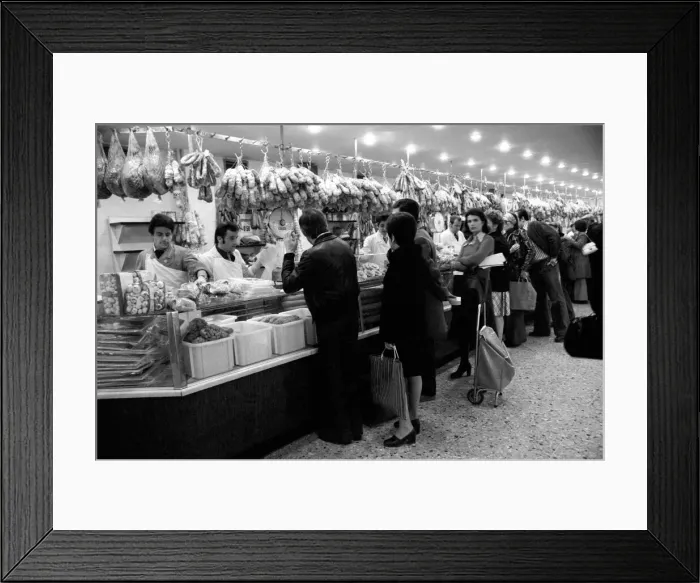 Framed Print : Local people queuing for meat at Boucherie Bernard'the largest butcher
