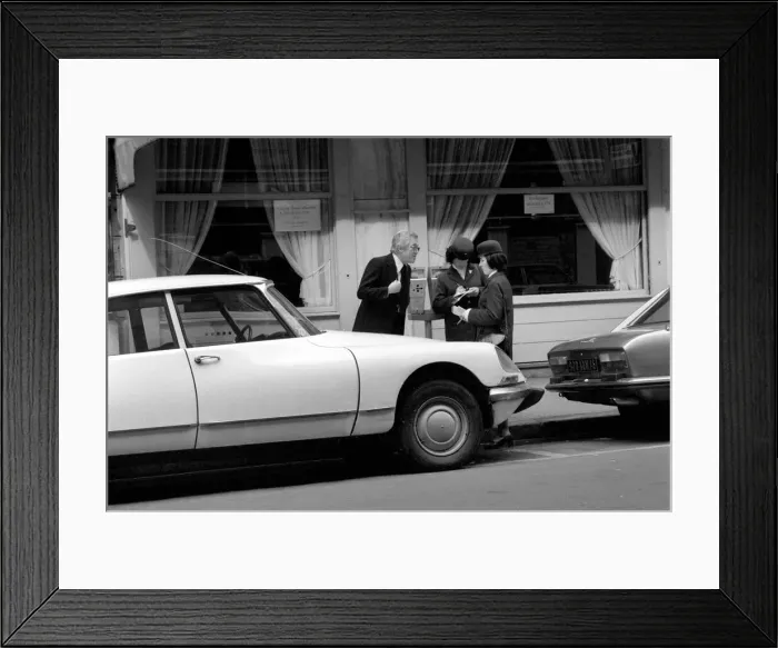 Framed Print : A car driver protesting to traffic wardens after they put a ticket on his car in Paris Framed Print : A car driver protesting to traffic wardens after they put a ticket on his car in Paris