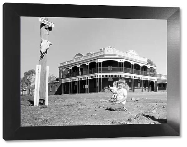 Gwalia: Ghost town western Australia. Kathyrn with her doll infront of what was once