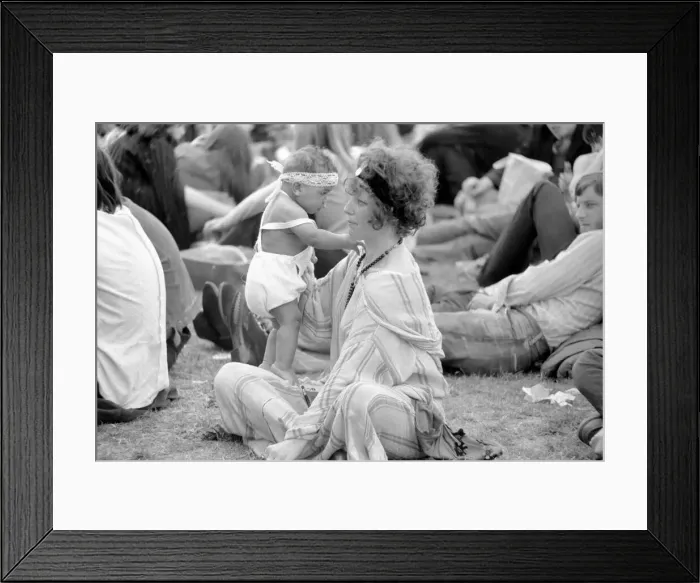 Framed Print : Hyde Park Pop Festival. Mother and child enjoy the sunshine on the grass Framed Print : Hyde Park Pop Festival. Mother and child enjoy the sunshine on the grass