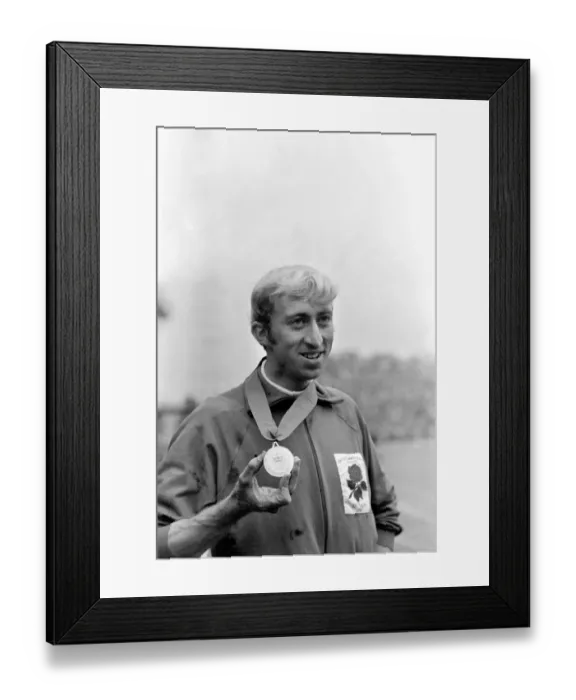 Framed Print : Commonwealth Games, Edinburgh: Athletics. David Hemery with gold medal after winning 110