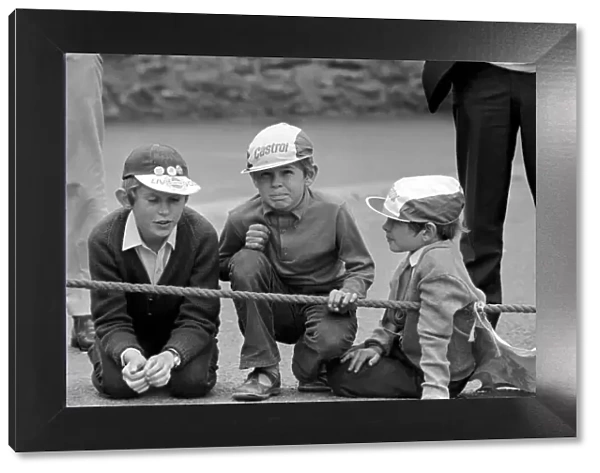 I. O. M. TT Races. Three young racing fans wait for the start 750cc Production Race