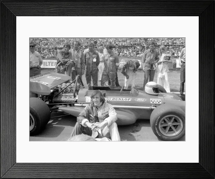 Framed Print : Brands Hatch. Jackie Stewart sitting beside his car before race. July 1970 70-6868-001 Framed Print : Brands Hatch. Jackie Stewart sitting beside his car before race. July 1970 70-6868-001