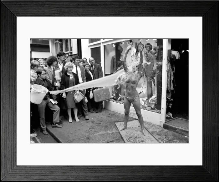 Framed Print : Glamour: Unusual: Helen Jones lies in tray of cement (Carol)
