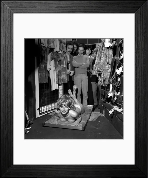 Framed Print : Glamour: Unusual: Helen Jones lies in tray of cement (Carol)