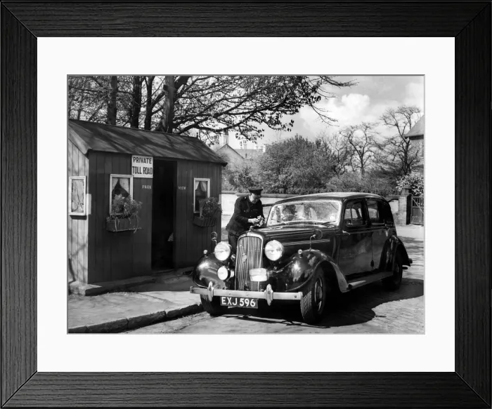 Framed Print : A passing motorist pays up at one of the toll boxes in Victoria Park, Manchester, to-day Framed Print : A passing motorist pays up at one of the toll boxes in Victoria Park, Manchester, to-day