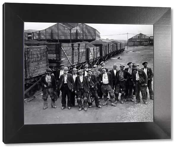 A train-Load in a day! Each of these sixteen miners, seen above, with the pit Deputy