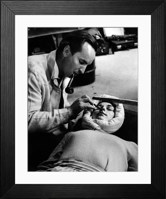 Framed Print : Make up artist John Lee who specialises in creating facial masks is seen here carefully Framed Print : Make up artist John Lee who specialises in creating facial masks is seen here carefully