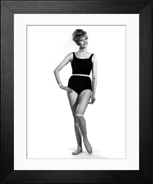 Framed Print : Reveille Fashions. Mannequin modeling a one piece swimming costume with a tape measure Framed Print : Reveille Fashions. Mannequin modeling a one piece swimming costume with a tape measure