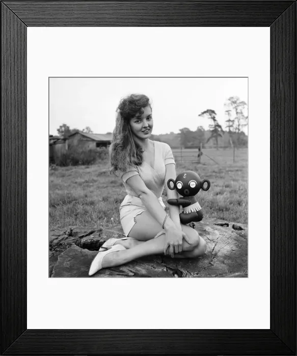 Framed Print : Model Kim Pearson seen here with inflatable alien toys. 1962 E422 Framed Print : Model Kim Pearson seen here with inflatable alien toys. 1962 E422